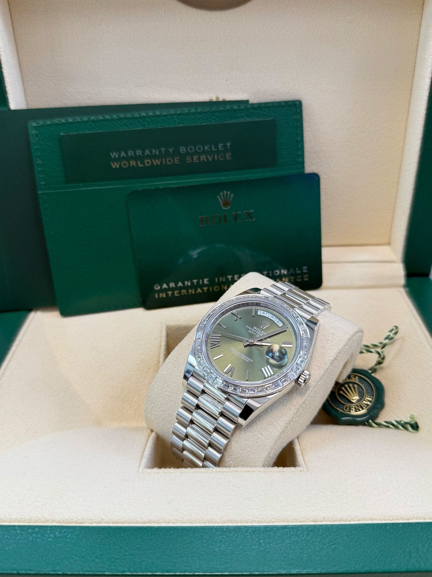 Rolex Day-Date 40 Baguette Diamond Bezel Olive Green Roman Dial President Bracelet 228396TBR