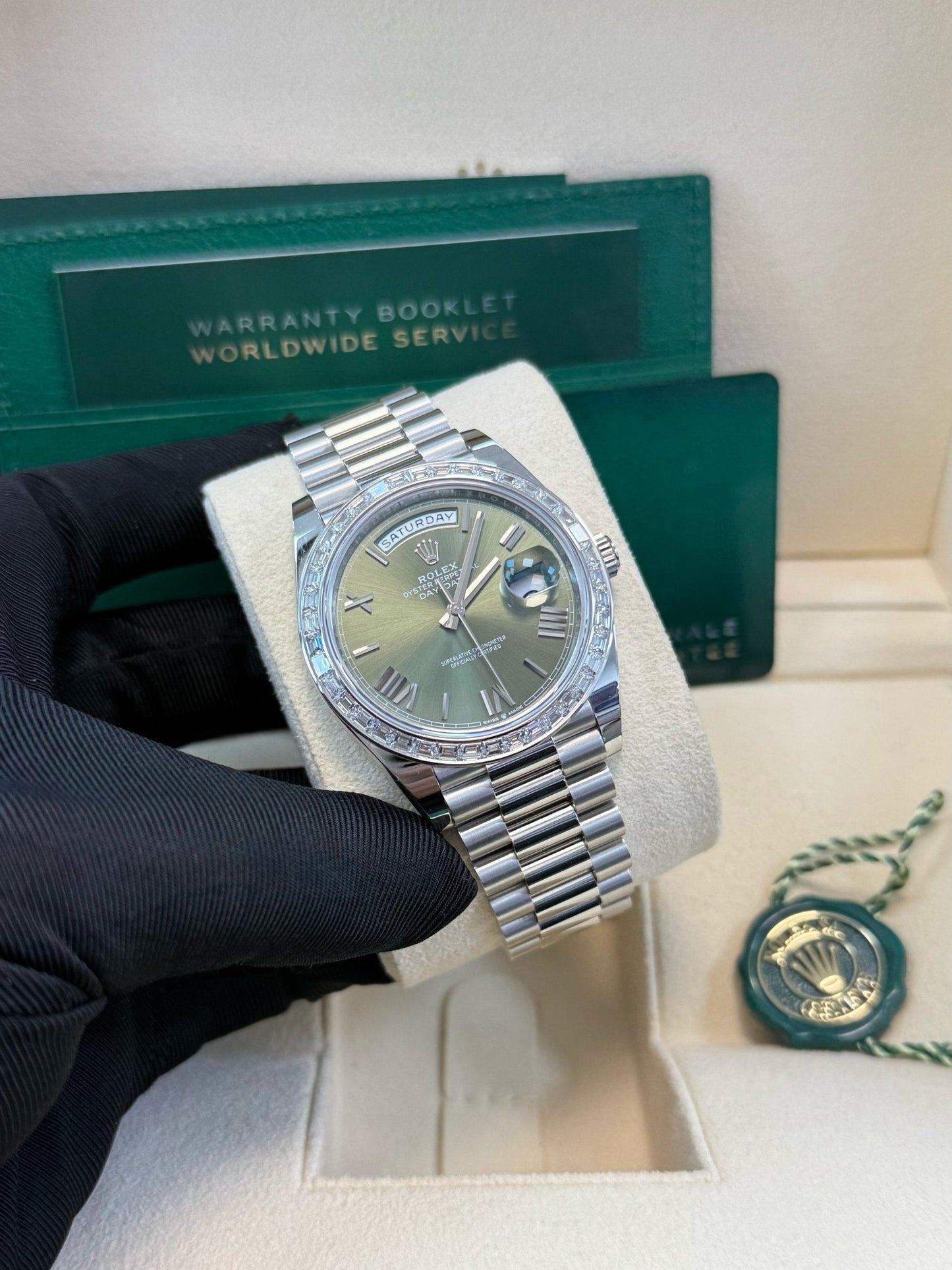 Rolex Day-Date 40 Baguette Diamond Bezel Olive Green Roman Dial President Bracelet 228396TBR