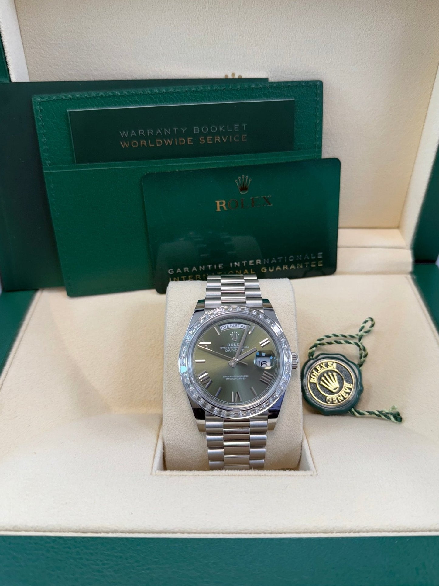 Rolex Day-Date 40 Baguette Diamond Bezel Olive Green Roman Dial President Bracelet 228396TBR German Day Wheel