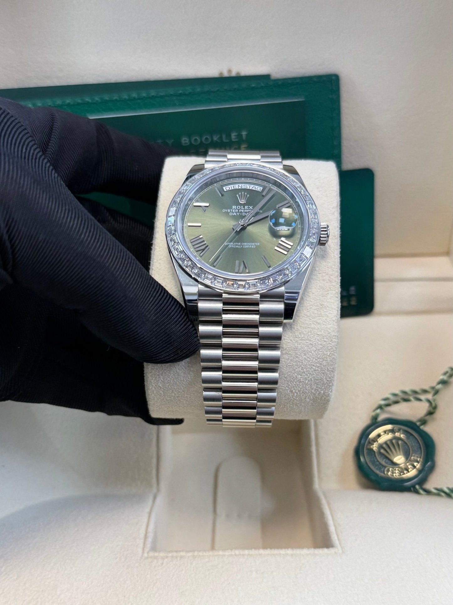 Rolex Day-Date 40 Baguette Diamond Bezel Olive Green Roman Dial President Bracelet 228396TBR German Day Wheel