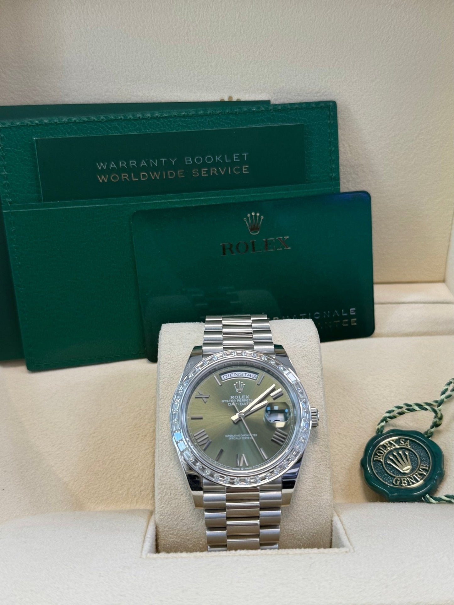 Rolex Day-Date 40 Baguette Diamond Bezel Olive Green Roman Dial President Bracelet 228396TBR German Day Wheel