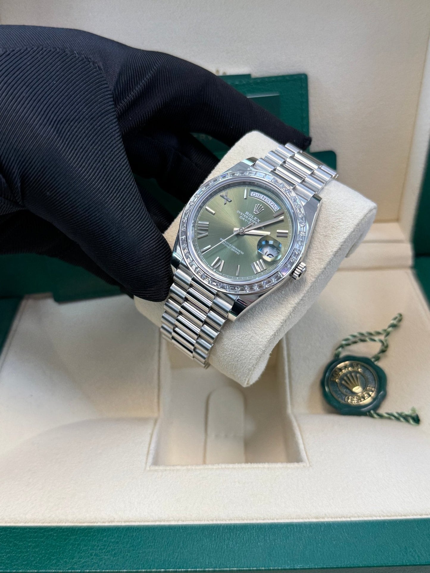 Rolex Day-Date 40 Baguette Diamond Bezel Olive Green Roman Dial President Bracelet 228396TBR German Day Wheel