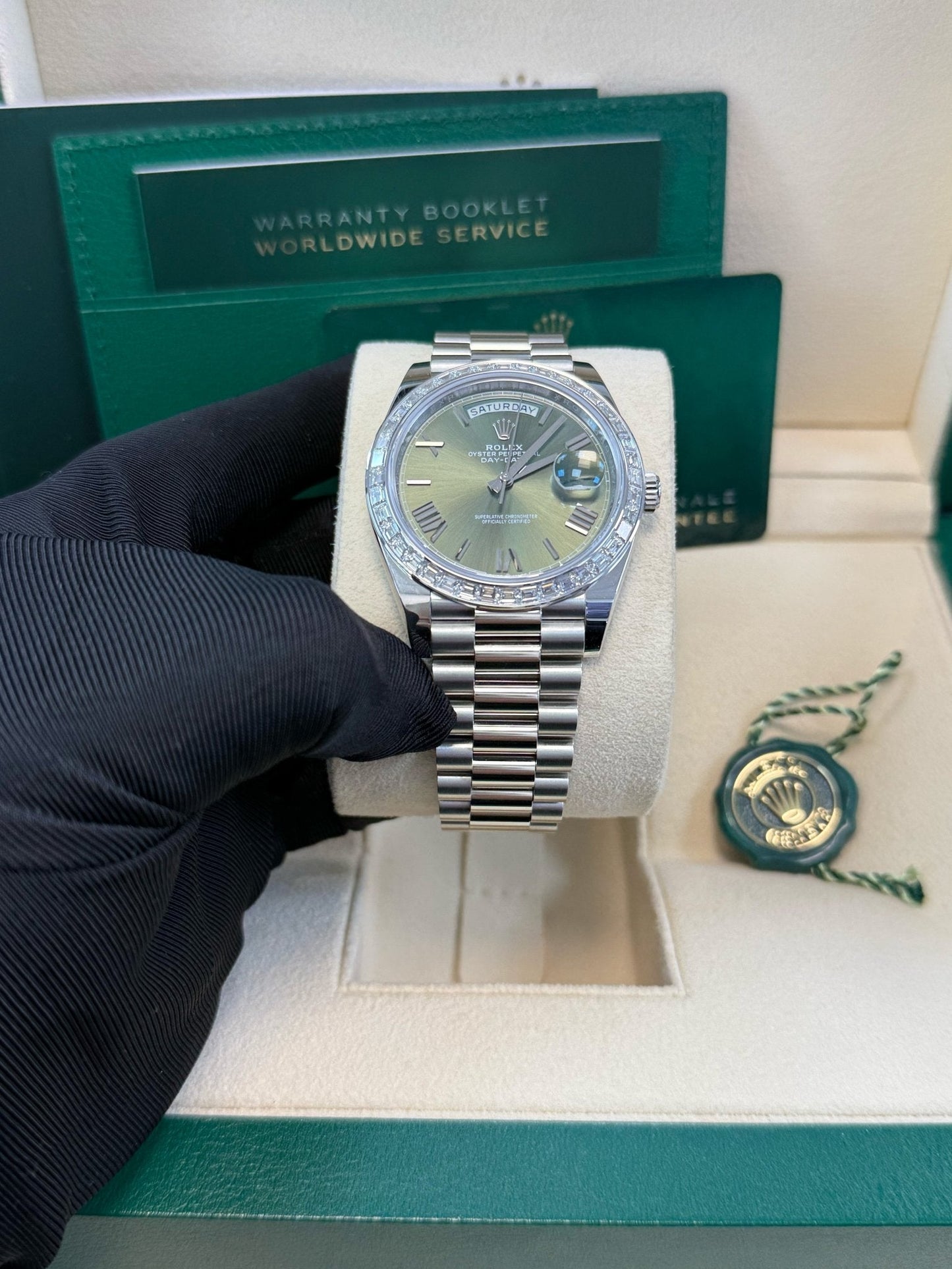 Rolex Day-Date 40 Baguette Diamond Bezel Olive Green Roman Dial President Bracelet 228396TBR