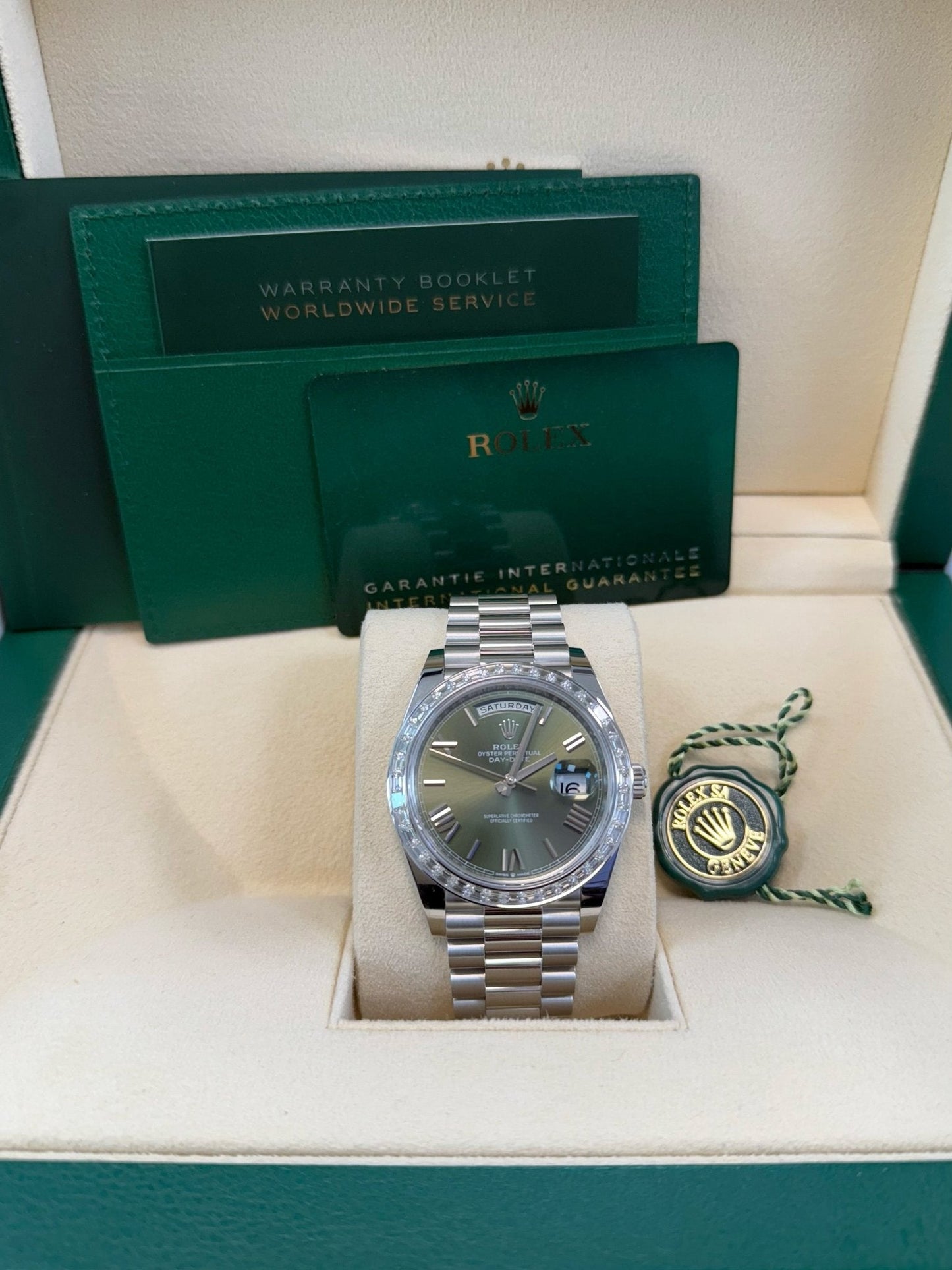 Rolex Day-Date 40 Baguette Diamond Bezel Olive Green Roman Dial President Bracelet 228396TBR