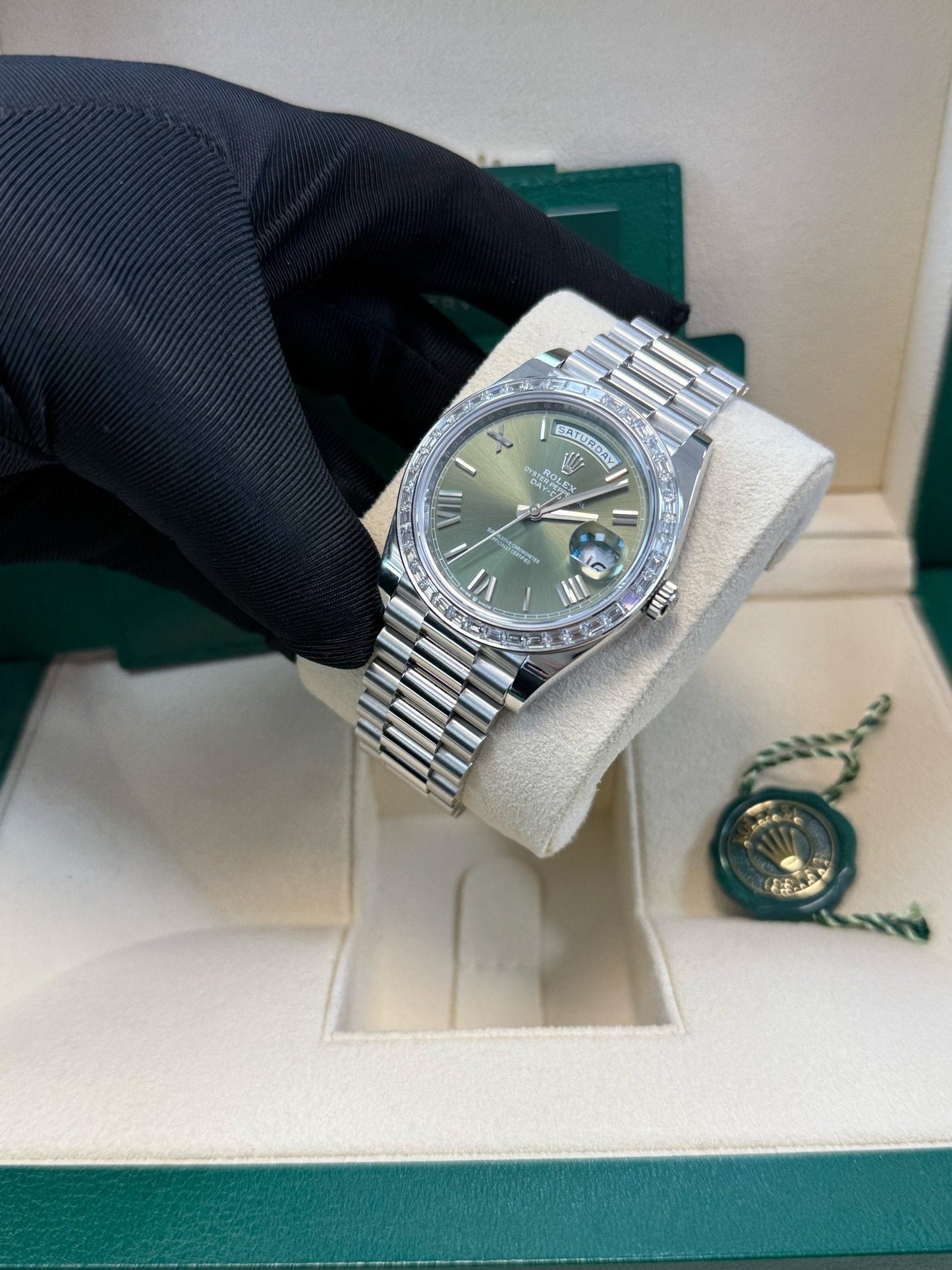 Rolex Day-Date 40 Baguette Diamond Bezel Olive Green Roman Dial President Bracelet 228396TBR