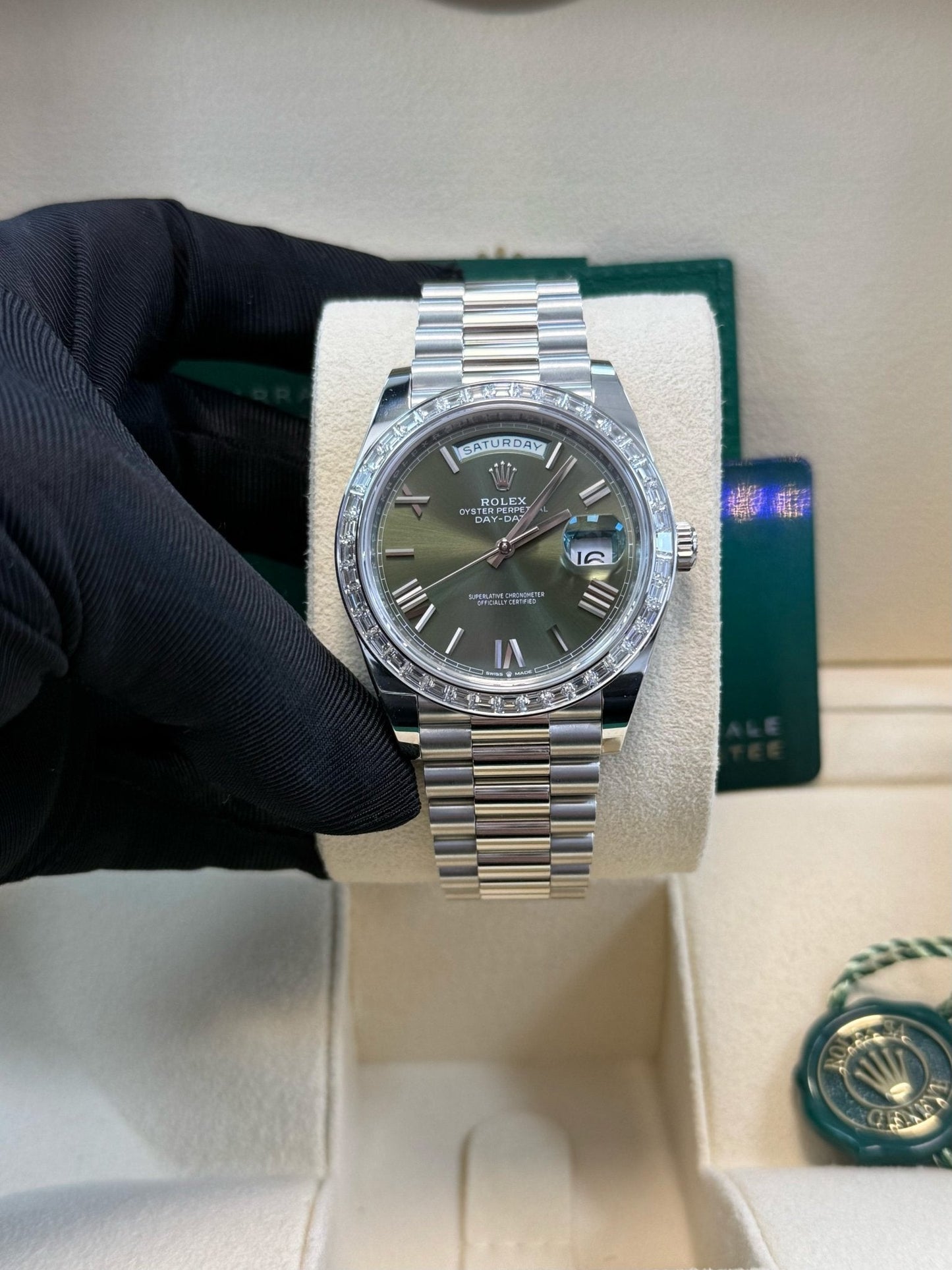 Rolex Day-Date 40 Baguette Diamond Bezel Olive Green Roman Dial President Bracelet 228396TBR