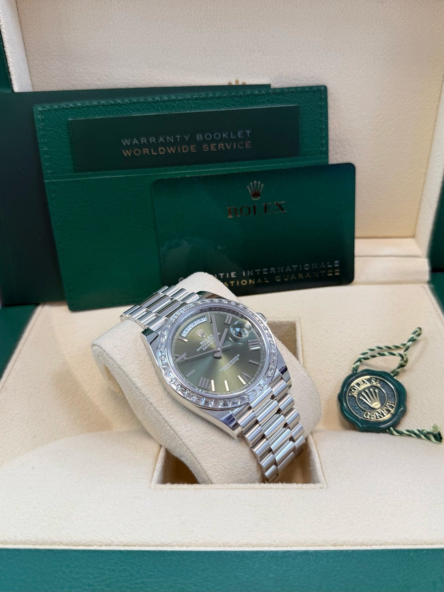 Rolex Day-Date 40 Baguette Diamond Bezel Olive Green Roman Dial President Bracelet 228396TBR
